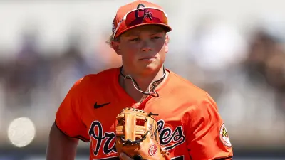 Jackson Holliday jogs across the field