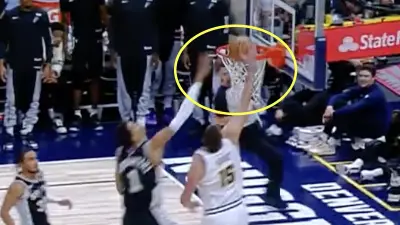 Nikola Jokic throws down a dunk on Victor Wembanyama