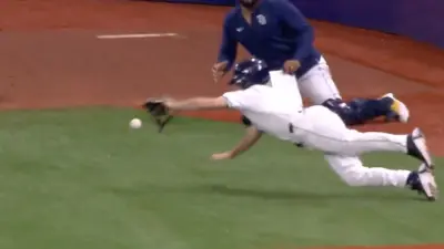 The Rays ball boy makes a diving play