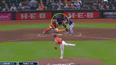 Angel Hernandez leans over