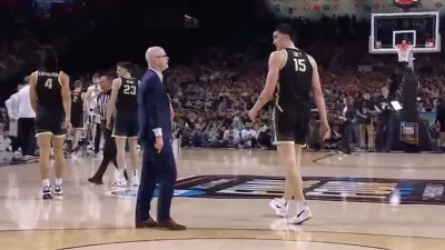 Dan Hurley and Zach Edey exchange words