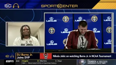 DJ Burns watching a Nikola Jokic press conference