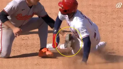 Jo Adell slides into second base