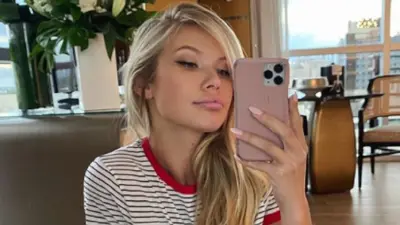 Josie holding up her phone