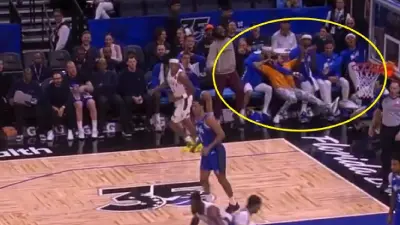 The Orlando Magic bench laughing