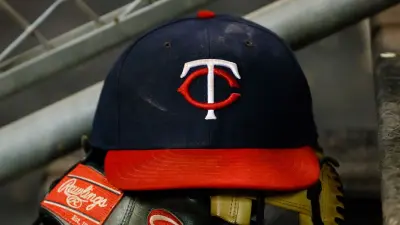 A Minnesota Twins hat in the dugout