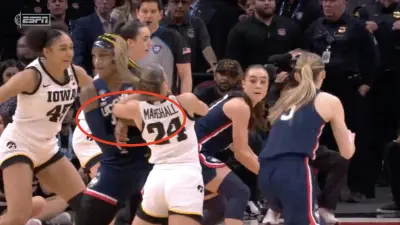 UConn star Aaliyah Edwards gets called for an offensive foul against Iowa