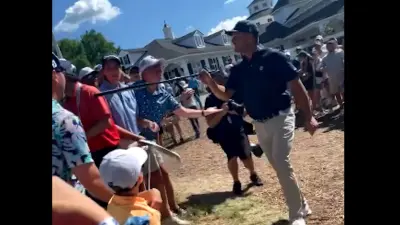 Bryson DeChambeau points at a fan