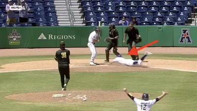 East Carolina player Dixon Williams steals home plate