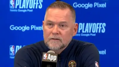 Michael Malone talking at a press conference