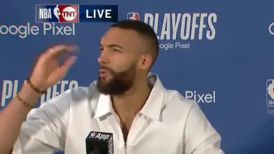 Rudy Gobert shielding his eyes