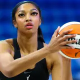 Angel Reese shoots during warmups