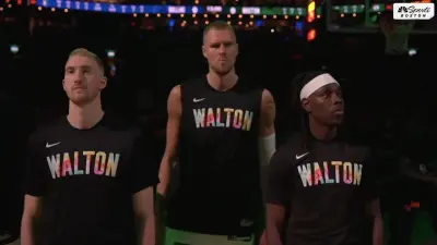 Celtics players wearing shirts honoring Bill Walton