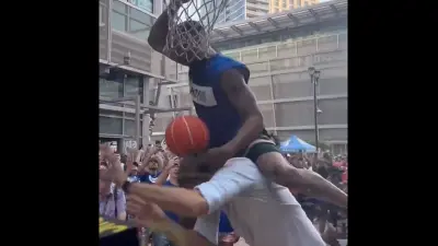A person on top of Dirk Nowitzki