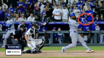Dodgers outfielder Teoscar Hernandez tries to check his swing against the Rockies