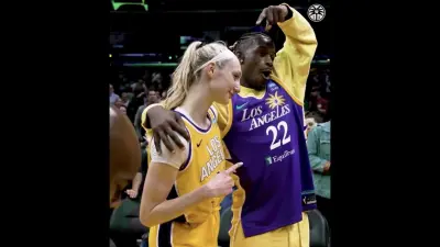 Jimmy Butler posing with Sparks star Cameron Brink while wearing her jersey