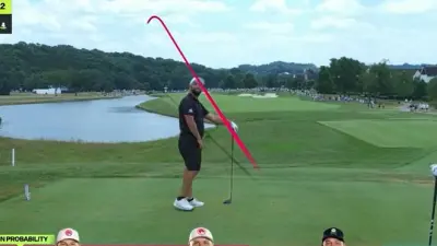 Jon Rahm looking at a drone