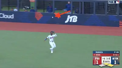 Mets outfielder Starling Marte trying to catch a baseball