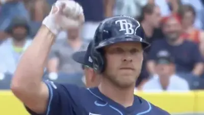Taylor Walls raises his fist in the air