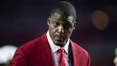 Adrian Wilson wearing a red suit