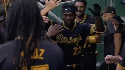 Andrew McCutchen giving high fives to his Pirates teammates