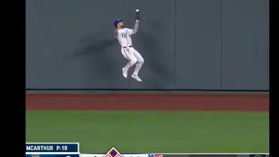 Kyle Isbel leaps against a wall