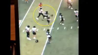 A player swings a helmet