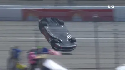 Corey LaJoie's No. 7 Chevrolet spinning at Michigan