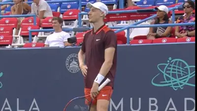 Denis Shapovalov with a hand on his hip