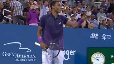 Felix Auger-Aliassime points his hand
