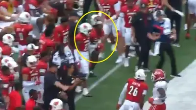 A Louisville player taking a shot to the nuts