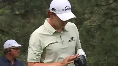 Matt Fitzpatrick touches his club