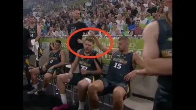 Nikola Jokic pouring water on Luka Doncic's head