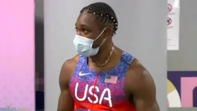 Noah Lyles in a mask