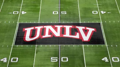 An aerial view of a UNLV field logo