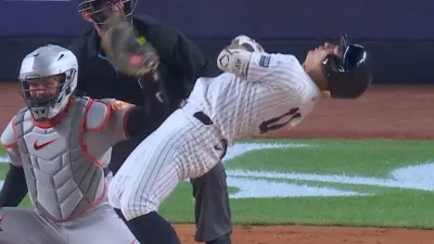 Anthony Volpe dodging a pitch