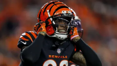 Bengals CB Cam Taylor-Britt holding his helmet