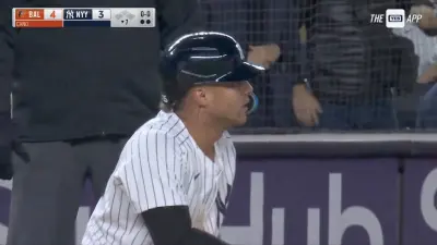 Yankees infielder Gleyber Torres kneeling