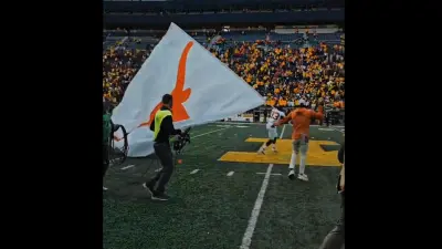 A Texas player holds a flag