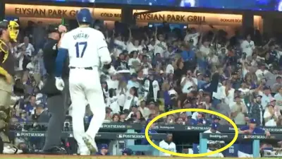 Manny Machado throws a ball toward the Dodgers dugout