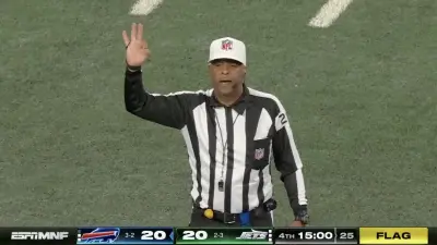 A referee makes a call during a Jets-Bills game