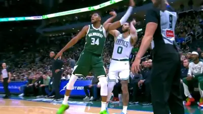 Jayson Tatum landing on Giannis Antetokounmpo's foot