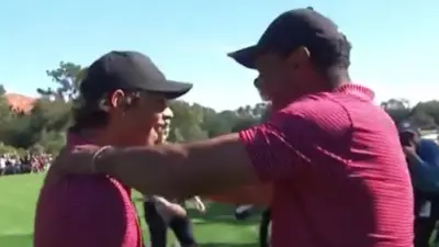 Tiger Woods celebrates his son Charlie making a hole in one