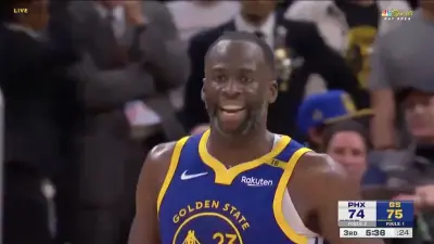 Draymond Green looking angry at Buddy Hield during a Warriors-Suns game