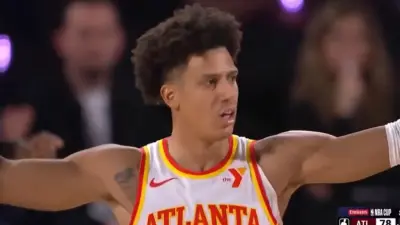Jalen Johnson raises his arms