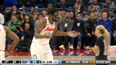 Joel Embiid arguing with a referee during a 76ers-Spurs game