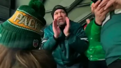 An Eagles fan shouts at a Packers fan