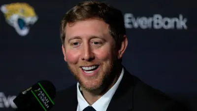 Liam Coen at a press conference