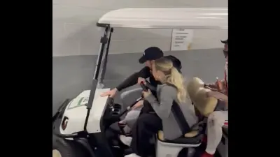 A golf cart driver crashes with Ryan Day