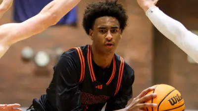 Alijah Arenas handling the basketball